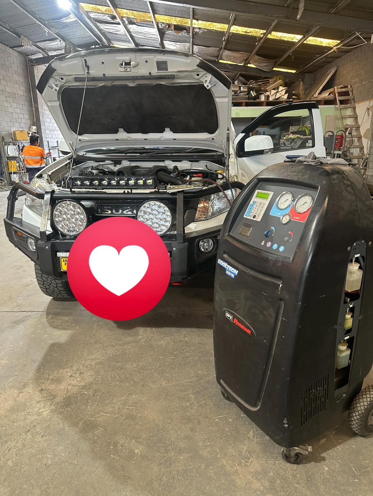 CLQ Automotive workshop — 4WD vehicle with bonnet open being serviced